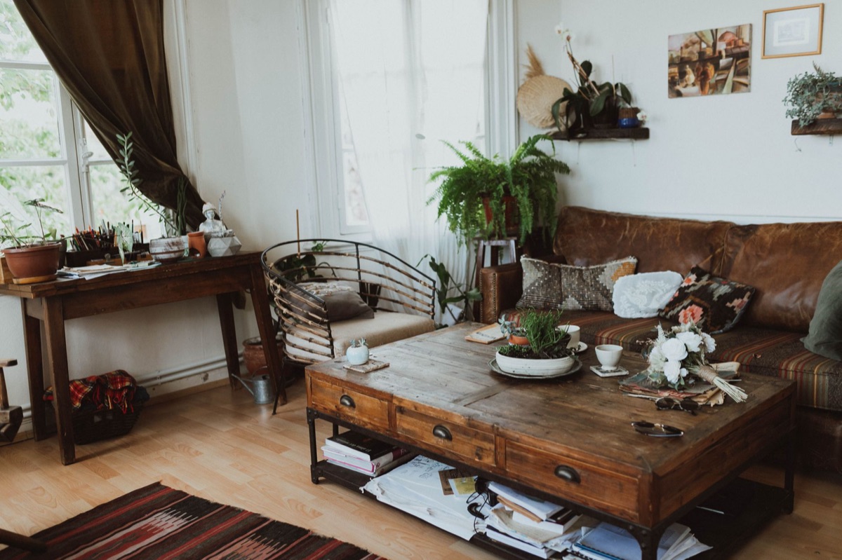 White couch and wooden coffee table in paris apartment